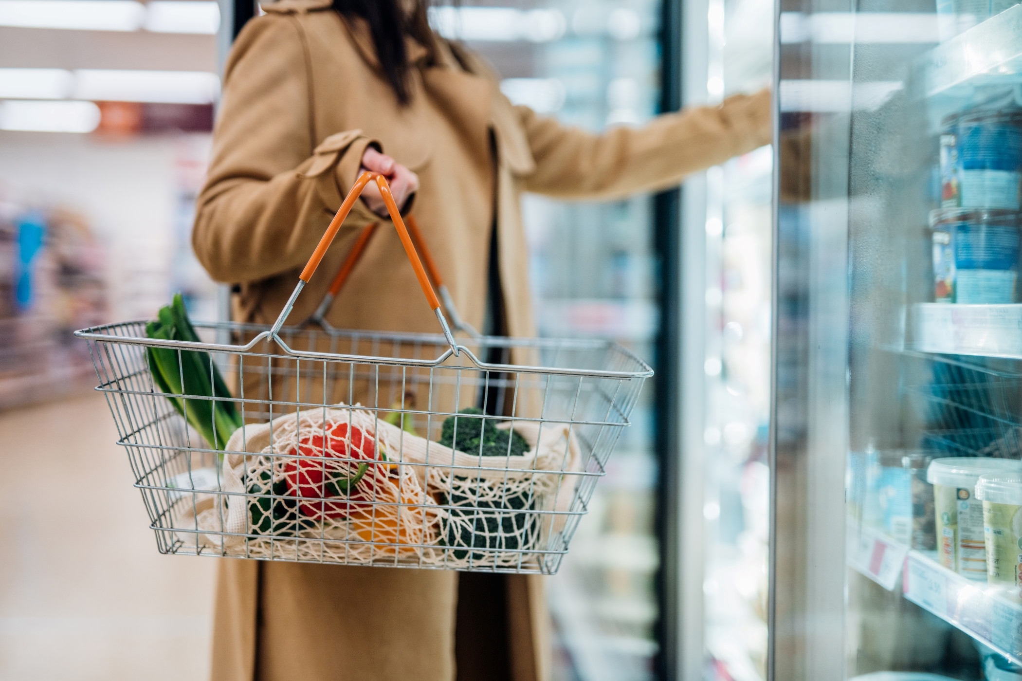 Consumers are feeling better about current economic conditions but staying cautious about future spending because of high grocery costs. (Getty Images)