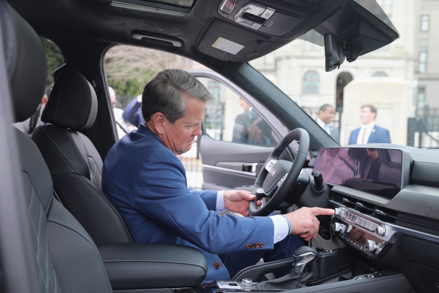 Georgia Gov. Brian Kemp checks out a Kia SUV made in his state at the inaugural Kia Day at the State Capitol in Atlanta. (Gov. Kemp's office, via Twitter)