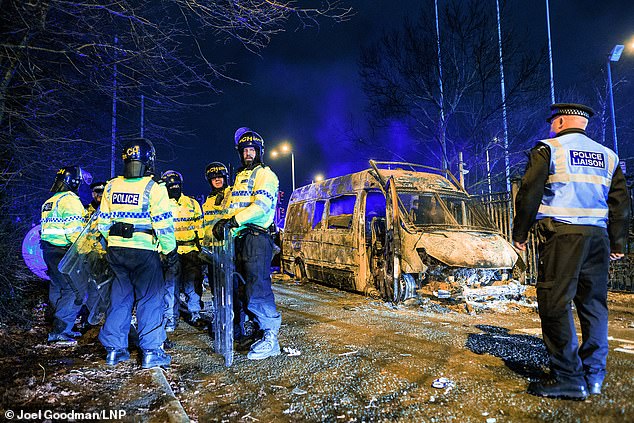 A police van was destroyed during the riot outside the Suites Hotel in Knowsley, February 10 2023