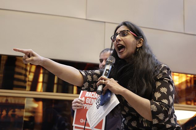 Seattle Council Member Kshama Sawant speaks to supporters and opponents of a proposed ordinance to add caste to Seattle