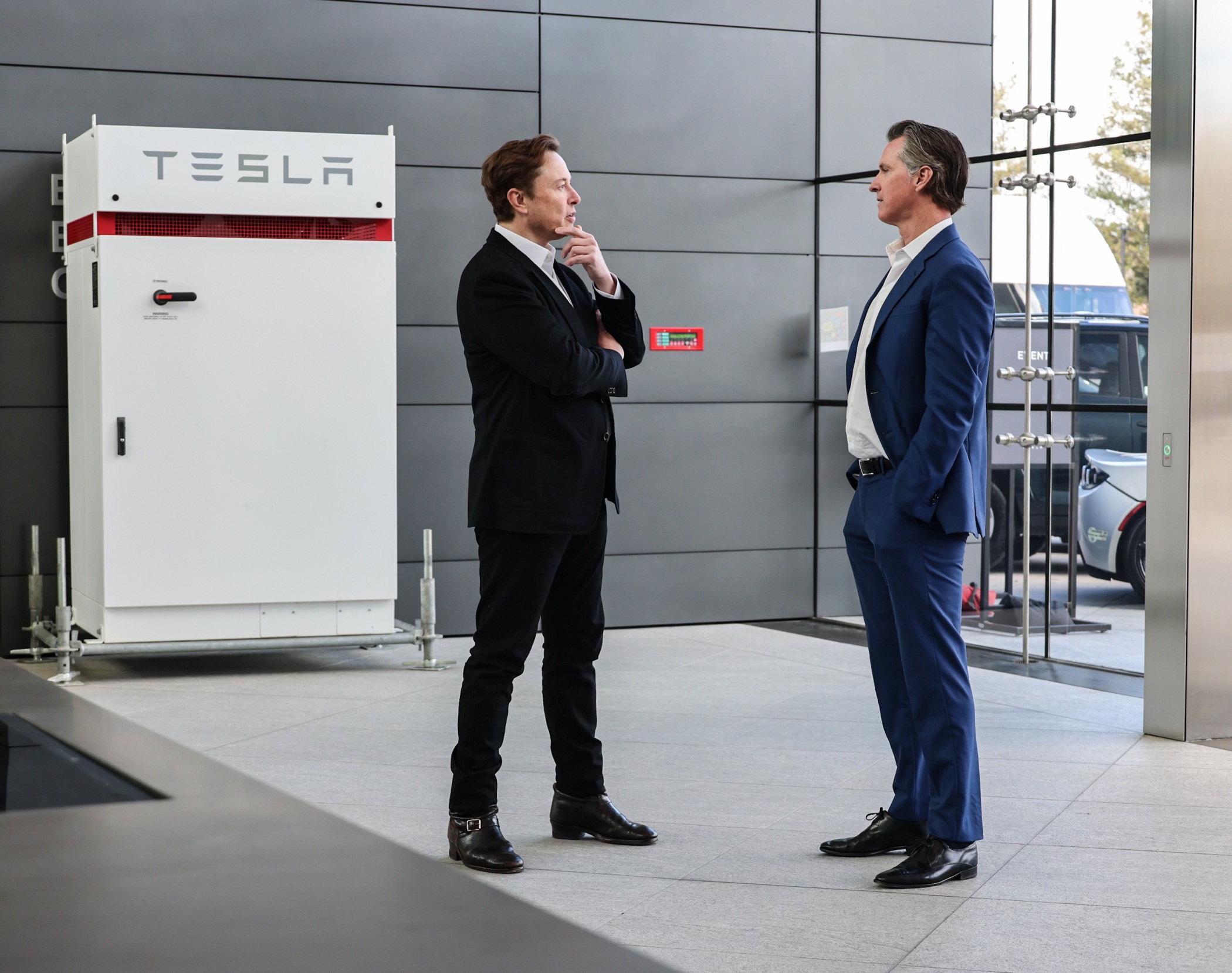 Tesla CEO Elon Musk, left, and California Gov. Gavin Newsom at Tesla's new headquarters for its global engineering and AI operations in Palo Alto, California. (California Governor's Office)