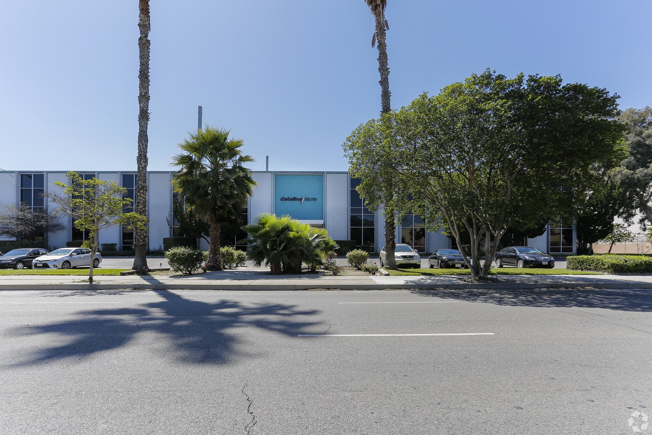 A roughly 184,000-square-foot warehouse at 21200 Victory Blvd. in Los Angeles has sold again. In 2022, permits were sought to convert the warehouse into a movie and TV production facility. (CoStar)
