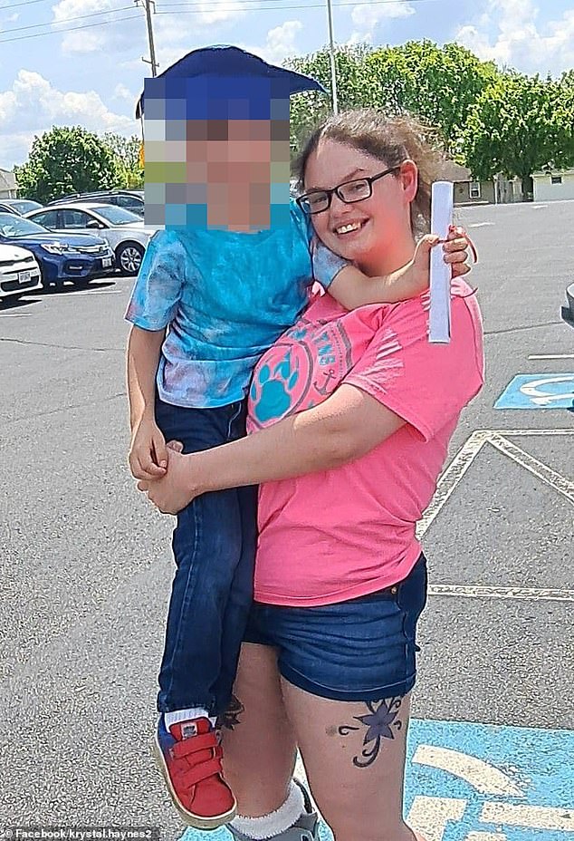 Krystal Harr is pictured with her 12 year-old son, who was filmed being bullied at school by black children and made to chant