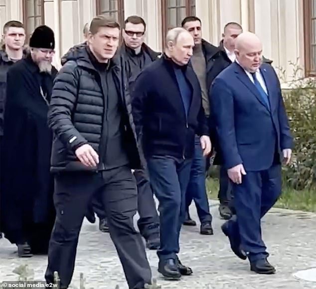 Vladimir Putin was seen limping as he made a surprise visit to Crimea amid claims he is suffering health problems, a day after war crimes arrest warrant was issued for the Russian leader