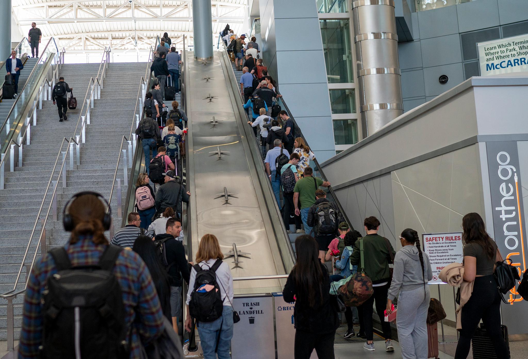 Airline passengers head to their flights at the Harry Reid International Airport in Las Vegas, Nevada. Hotel industry analysts said that while there's ongoing economic uncertainty, hotel industry fundamentals remain strong because people are still traveling for leisure and work. (Getty Images)