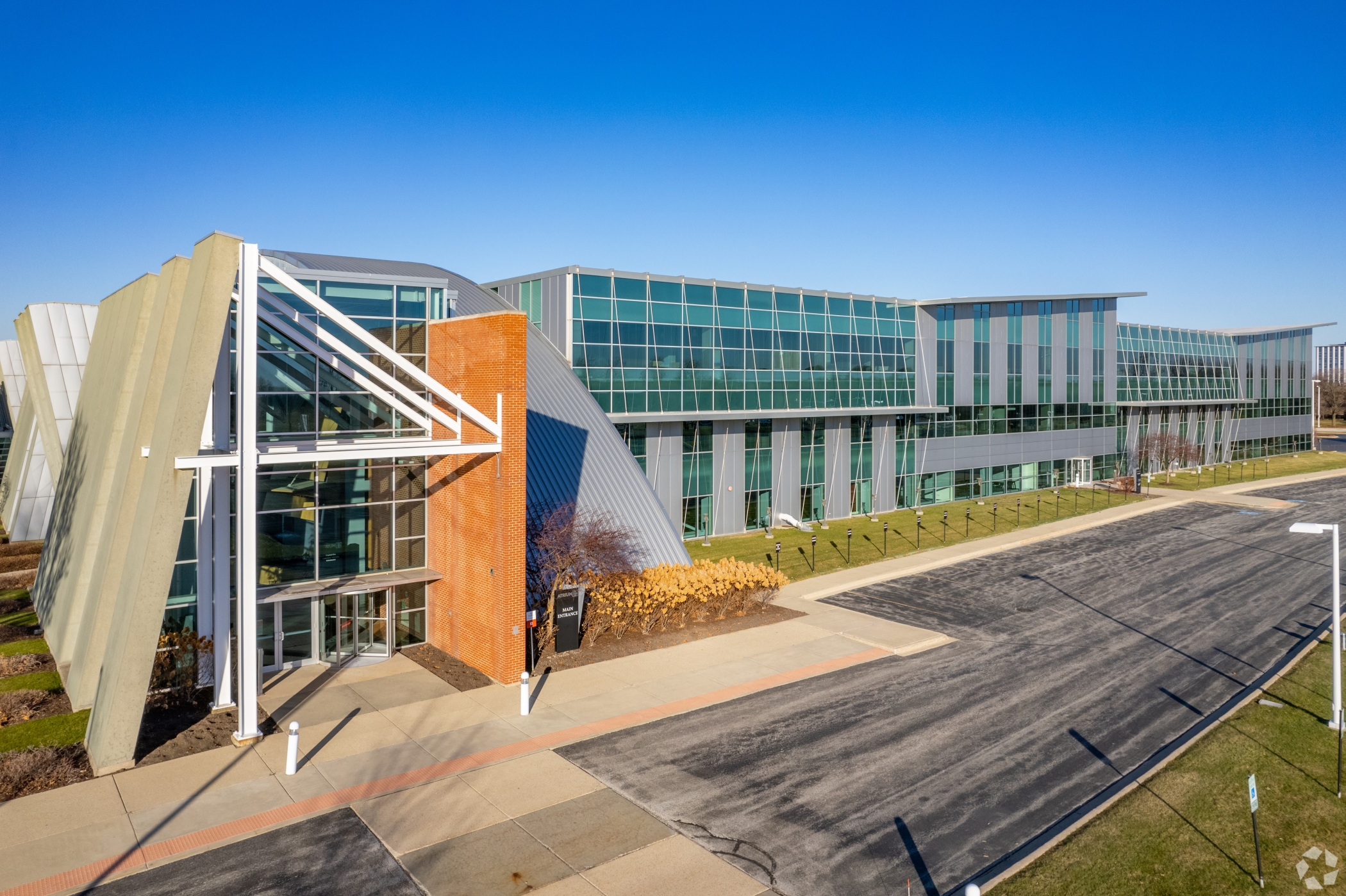 Brennan Investment Group has bought the Atrium, a three-story office building at 3800 Golf Road in Rolling Meadows, Illinois. It plans to eventually demolish the building for an industrial development on the 40-acre site. (Justin Schmidt/CoStar)