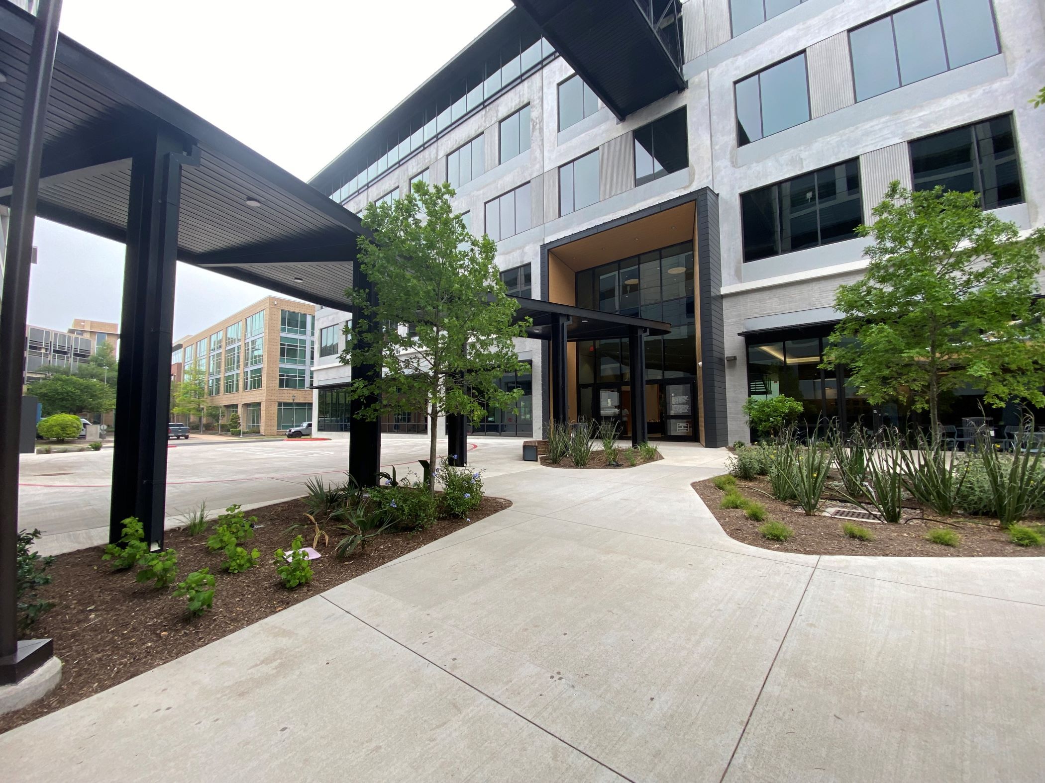 1401 Philomena at Mueller is the newest medical office building in Austin. Pictured here is the courtyard entrance, with a turnaround in front of the main doors. (Parimal M. Rohit/CoStar News)