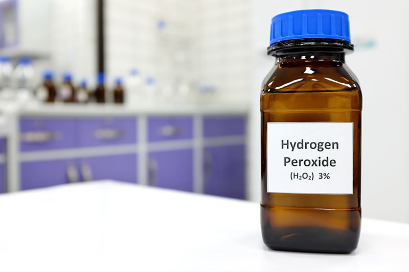 Selective focus of hydrogen peroxide solution in brown amber bottle
