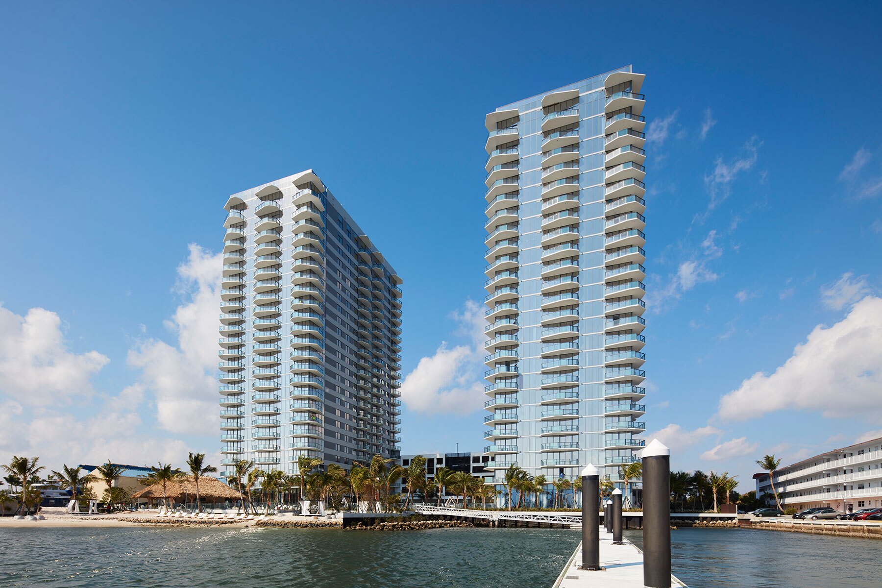 Balconies on Icon Marina Village intentionally designed to give the appearance of wind in sails. (Dana Hoff for CoStar)